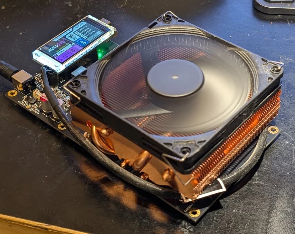 Air-cooled NerdQaxe++ with fan and display from the original shufps open-hardware project